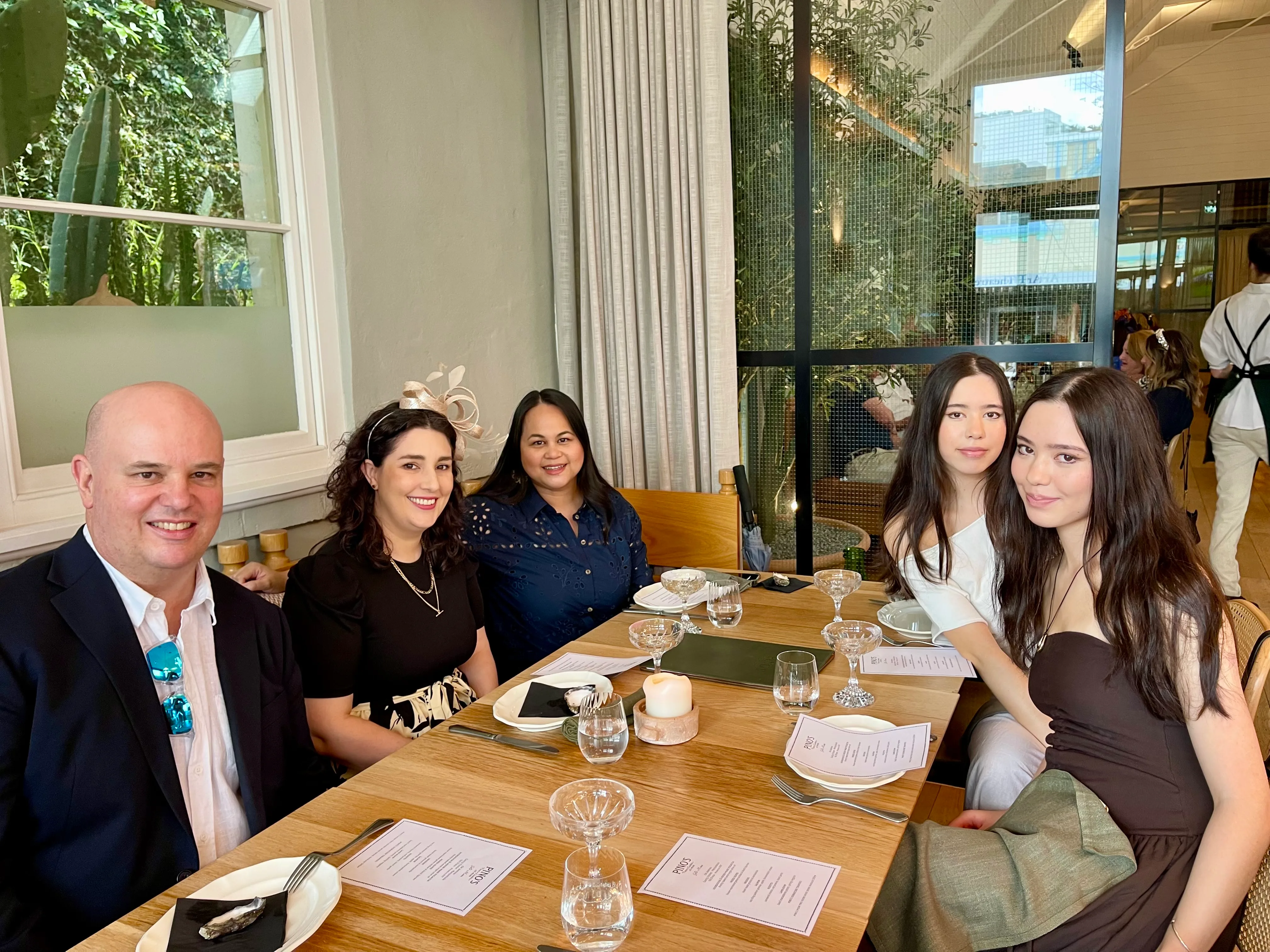 Dr Adrian Hunt with members of the practice team at the 2025 Melbourne Cup lunch in Cronulla