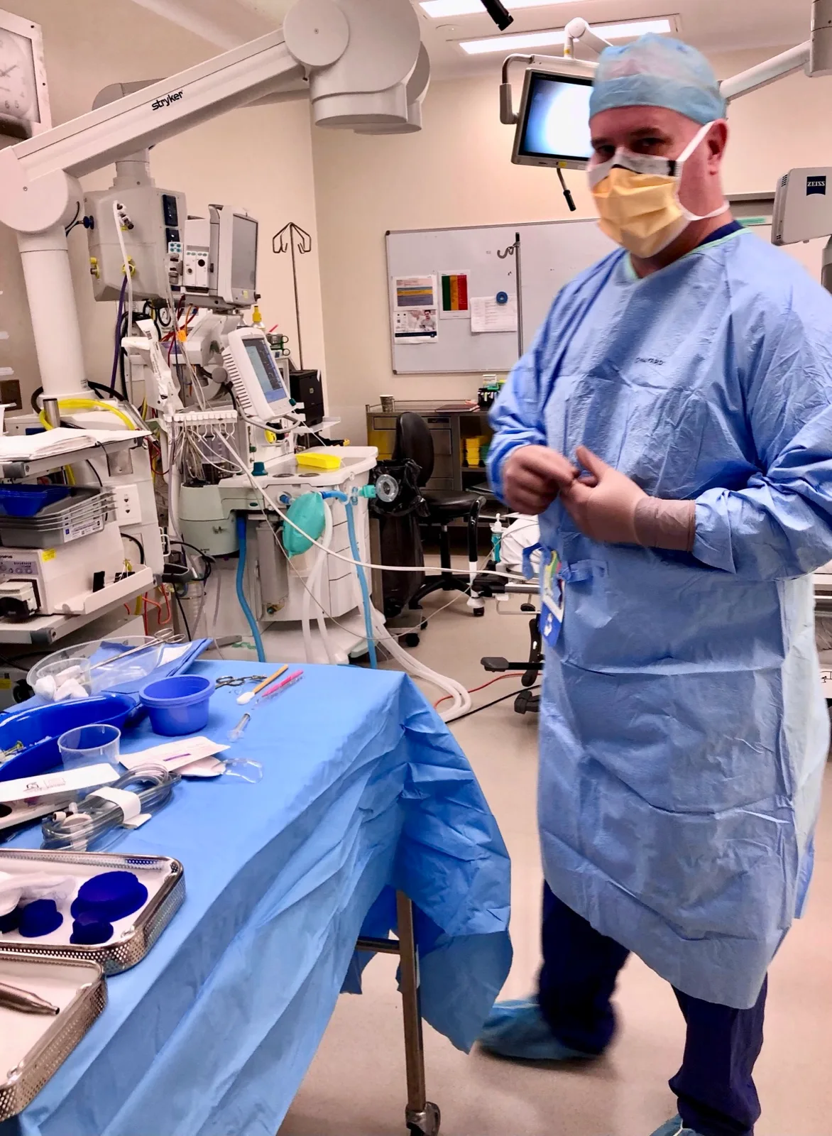 Dr Adrian Hunt gowned in the operating theatre, Miranda