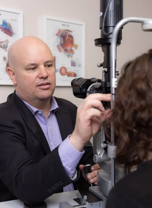 Dr Adrian Hunt examining a patient at the slit lamp