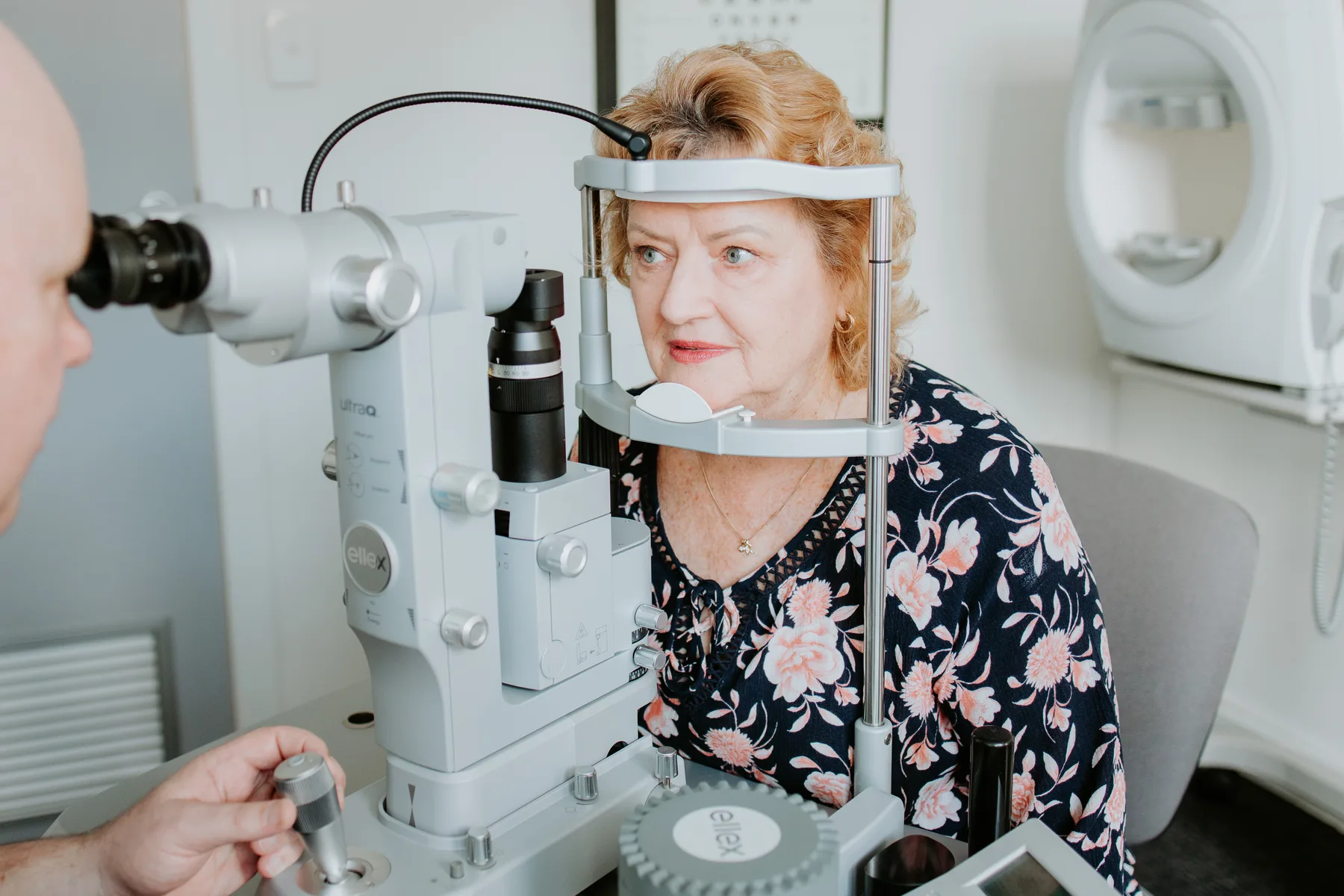 A patient positioned at the Ellex YAG laser for an in-rooms procedure at Eye Surgeons Miranda